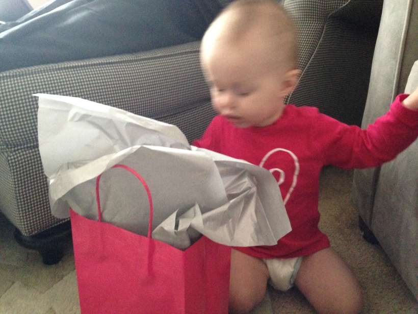 Blurry is not blog-worthy, but this is all I have when it comes to opening her present.